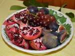 Pomengrates and other fruit in a bowl